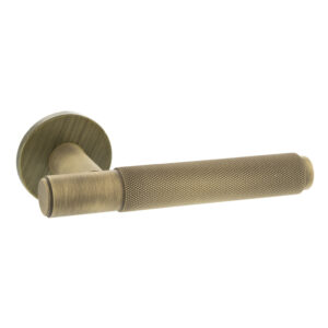 MHSR100YB Millhouse Brass Crompton Knurled Lever Door Handle on 5mm Slimline Round Rose - Yester Bronze